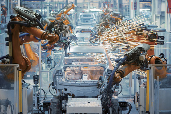 Robots at car manufacturing factory