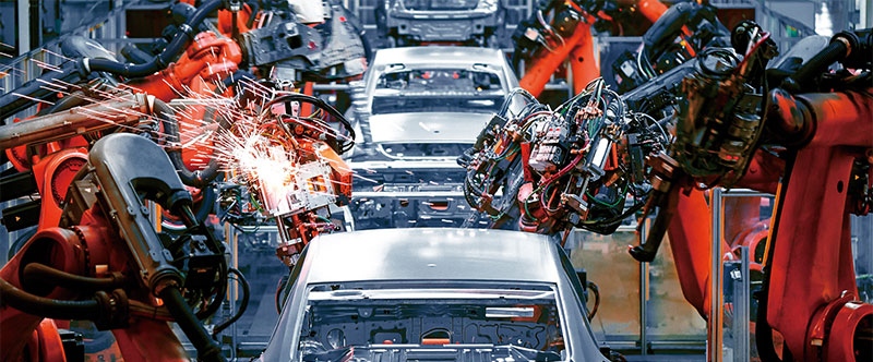 Cars being built in factory